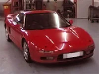 A red Honda in the workshop